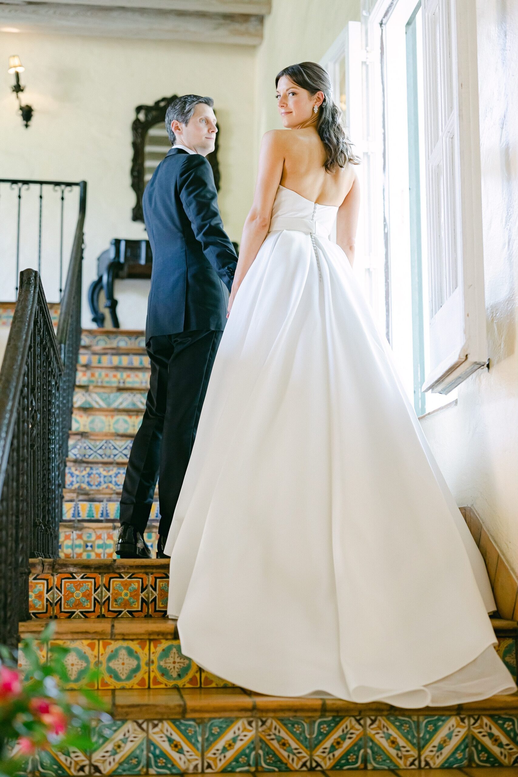 Editorial portrait of bride and groom at the Villa Woodbine staircase