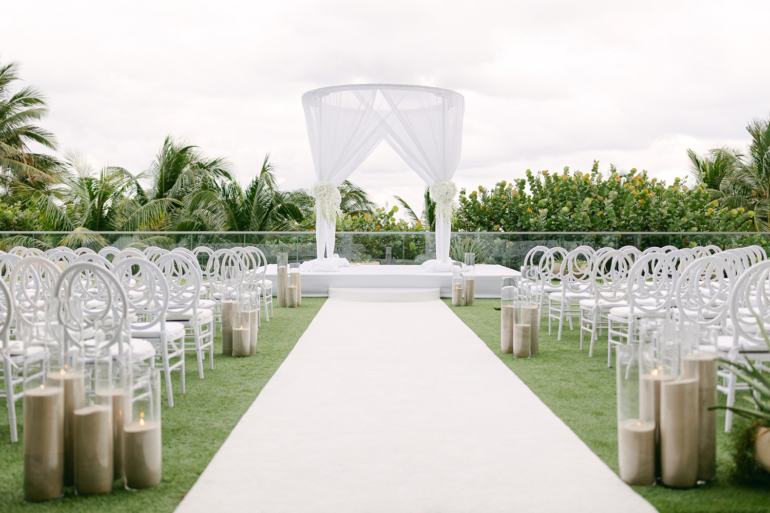 Wide angle perspective of the white orchid ceremony at the hotel terrace