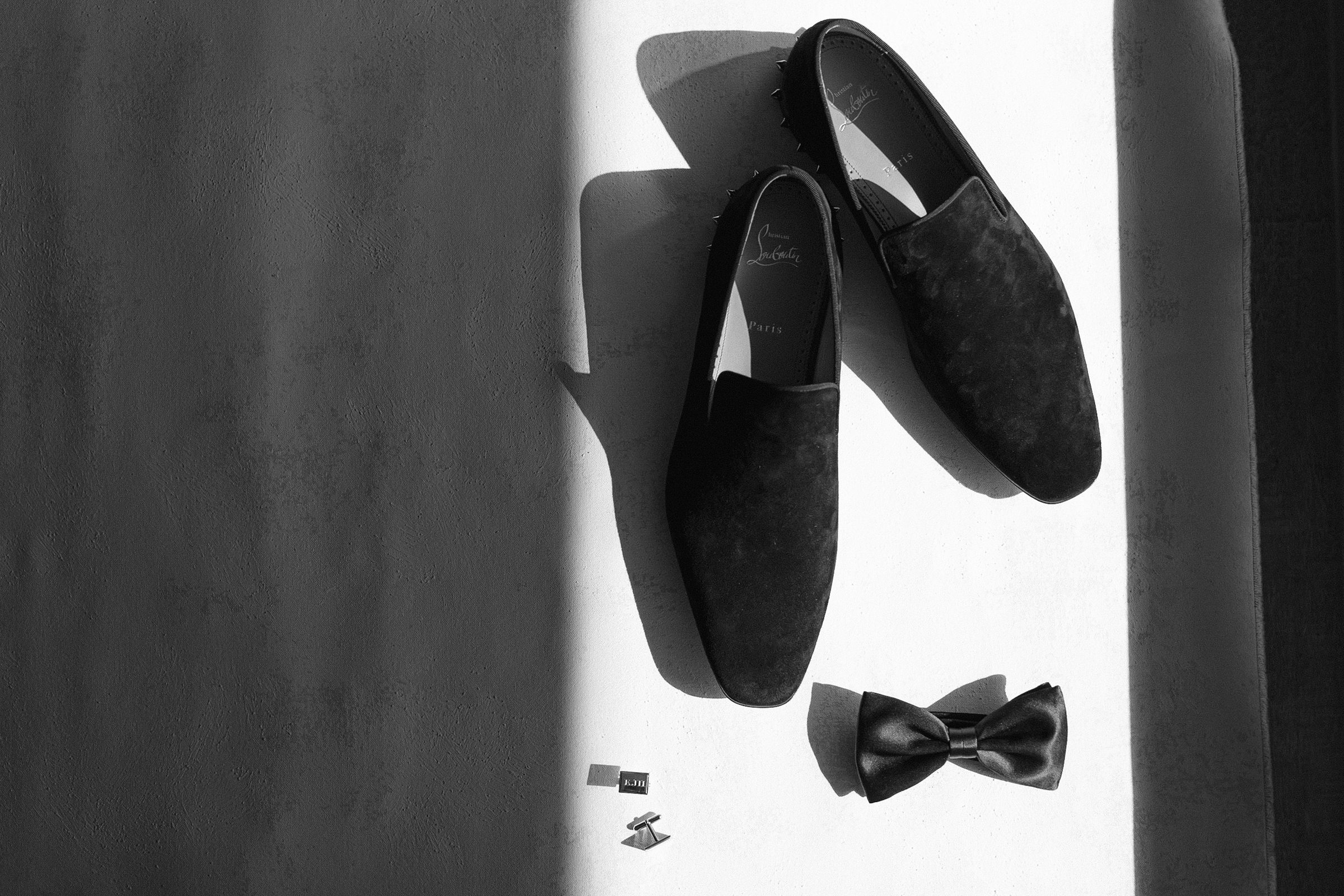 black and white image of grooms louis vuitton shoes