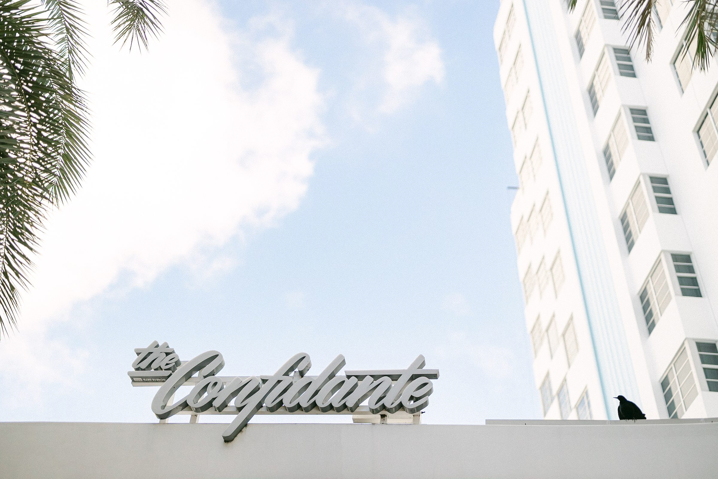 The front of the Confidante Hotel sign
